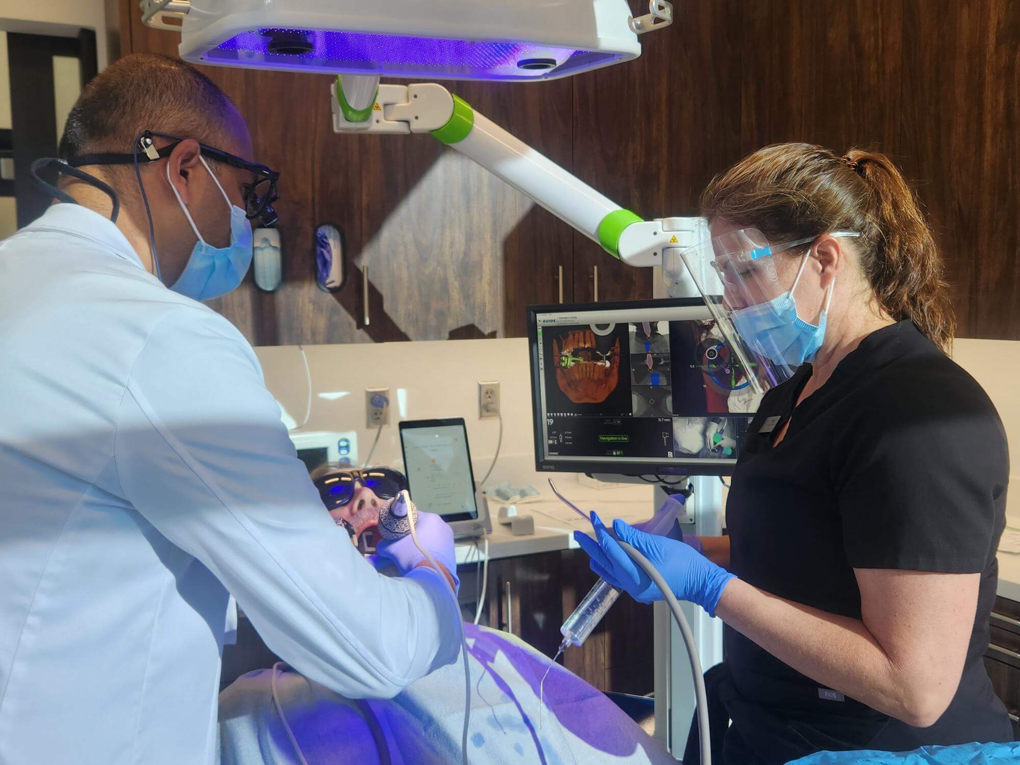 top oral surgeon team works on patient